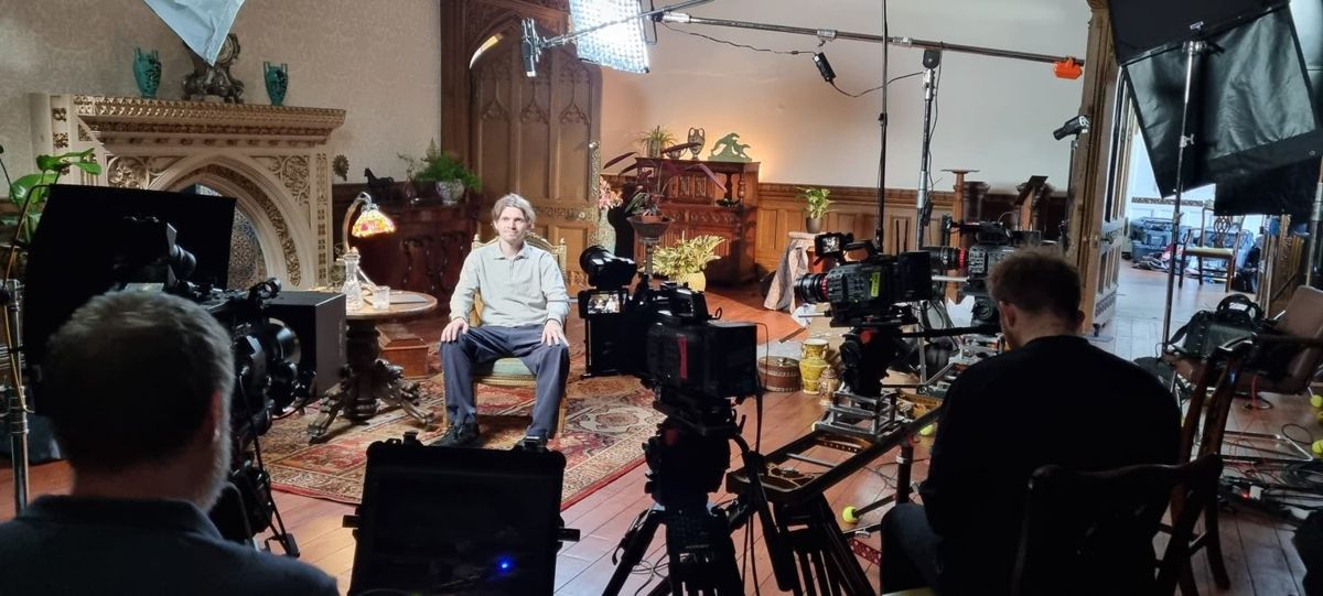 Multi-camera interview in a panelled room
