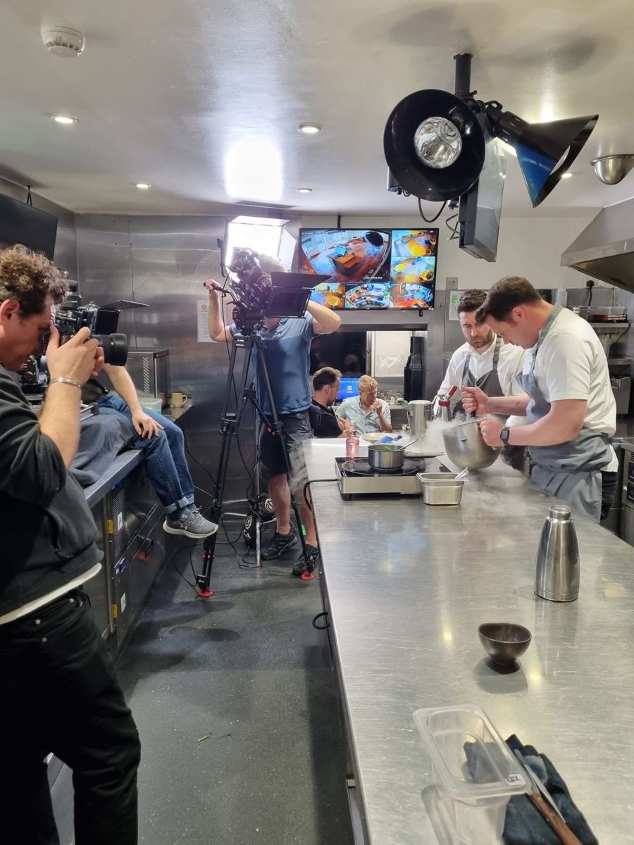 Crew filming in a kitchen