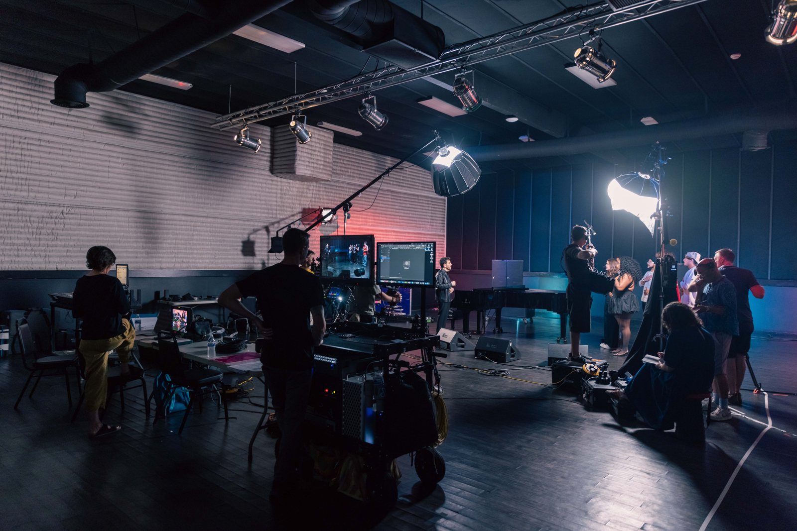 Crew, lighting and monitors on a studio music shoot